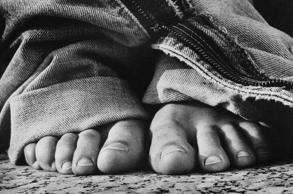 Photo of jeans and feet close up by Tony ward from the book of Obsessions 1998