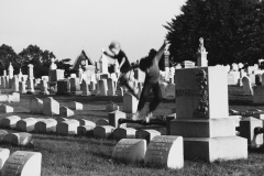 Tony_Ward_photography_early_work_1970's_Lancaster_Pa_graveyard_children_playing_on_tombstones_jumping