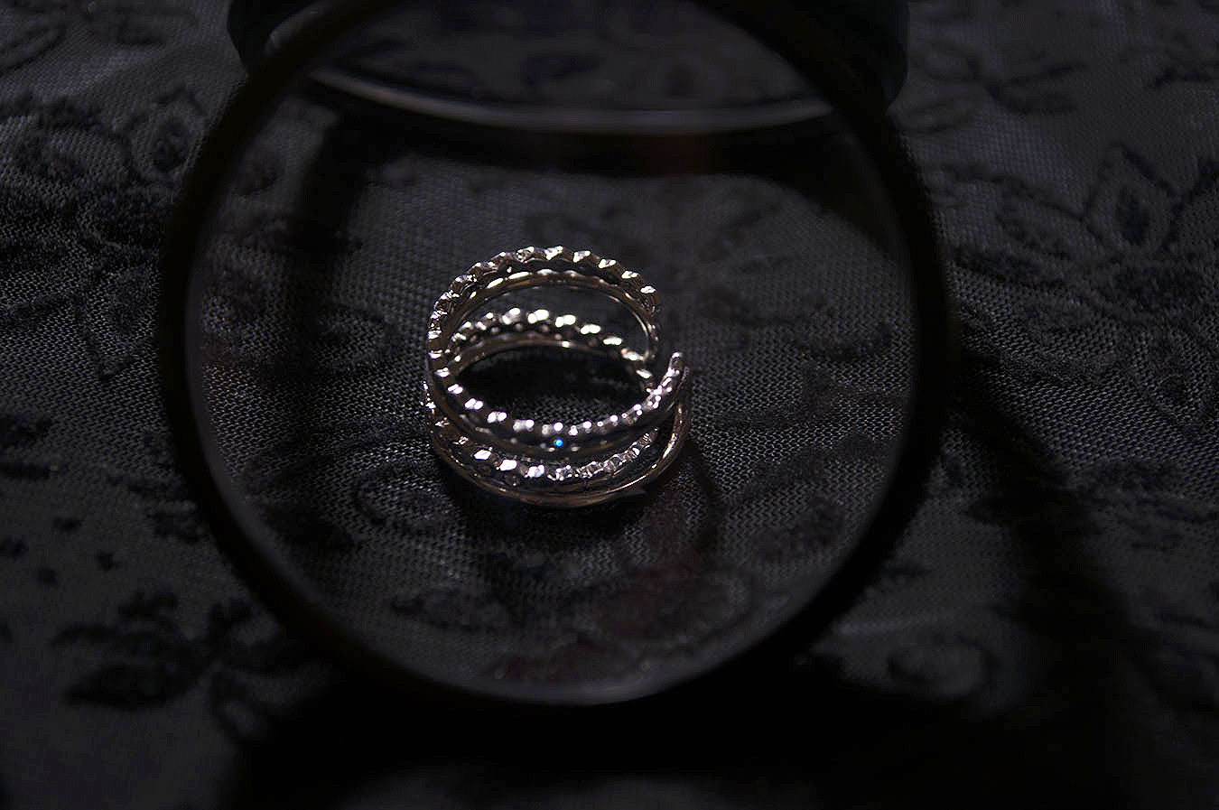 Rebecca_Huang_still_life_photography_dark_velvet_accessories_rings_jewelry_lens_magnifying_reflection_silver_honeycomb_jewels_floral_stacked