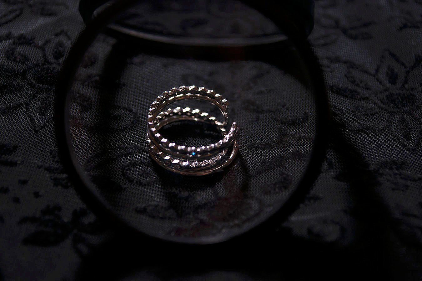 Rebecca_Huang_still_life_photography_dark_velvet_accessories_rings_jewelry_lens_magnifying_reflection_silver_honeycomb_jewels_floral_stacked