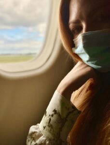 picture of Katie Kerl on her way to Atlanta by air wearing mask