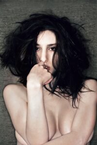 Portrait of topless woman covering breast due to the censorship rules on social media