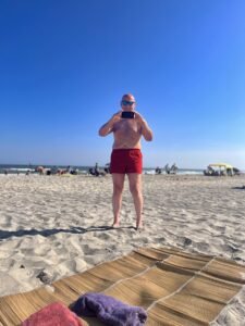 Tony Colagreco in red shorts at the beach in Margate NJ