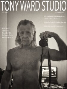 Man looking in the mirror with camera no shirt aging