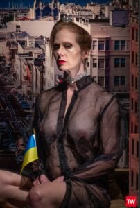 Portrait of woman holding a Ukranian flag