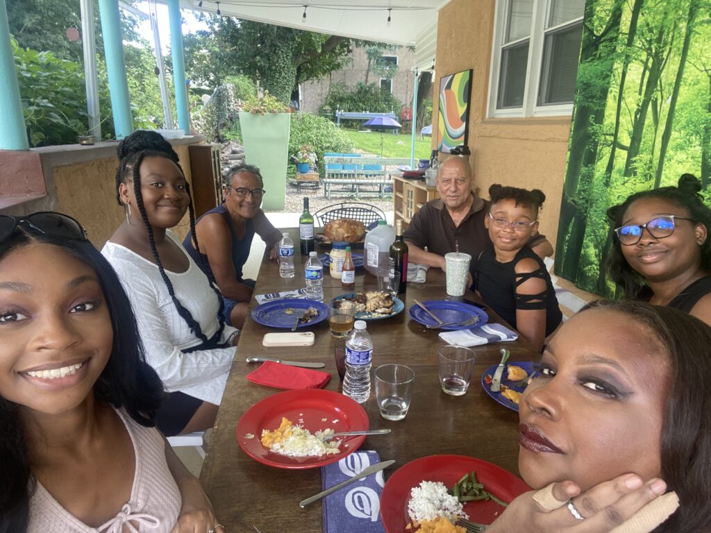 A gathering of the Williams family having lunch with Tony Ward
