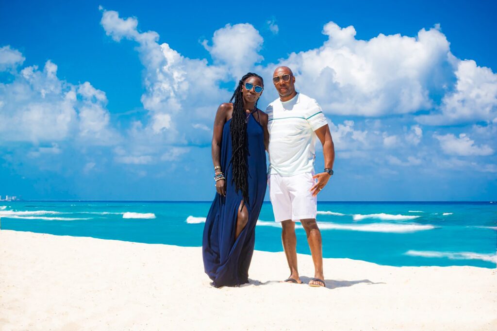 A beautiful black couple on a sunny beach in the Bahamas