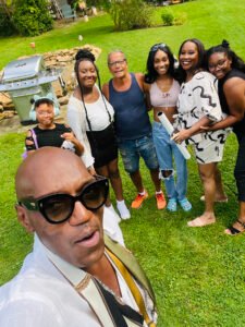 Tony Ward and the Williams family with creative director KVaughn celebrate a successful photo shoot