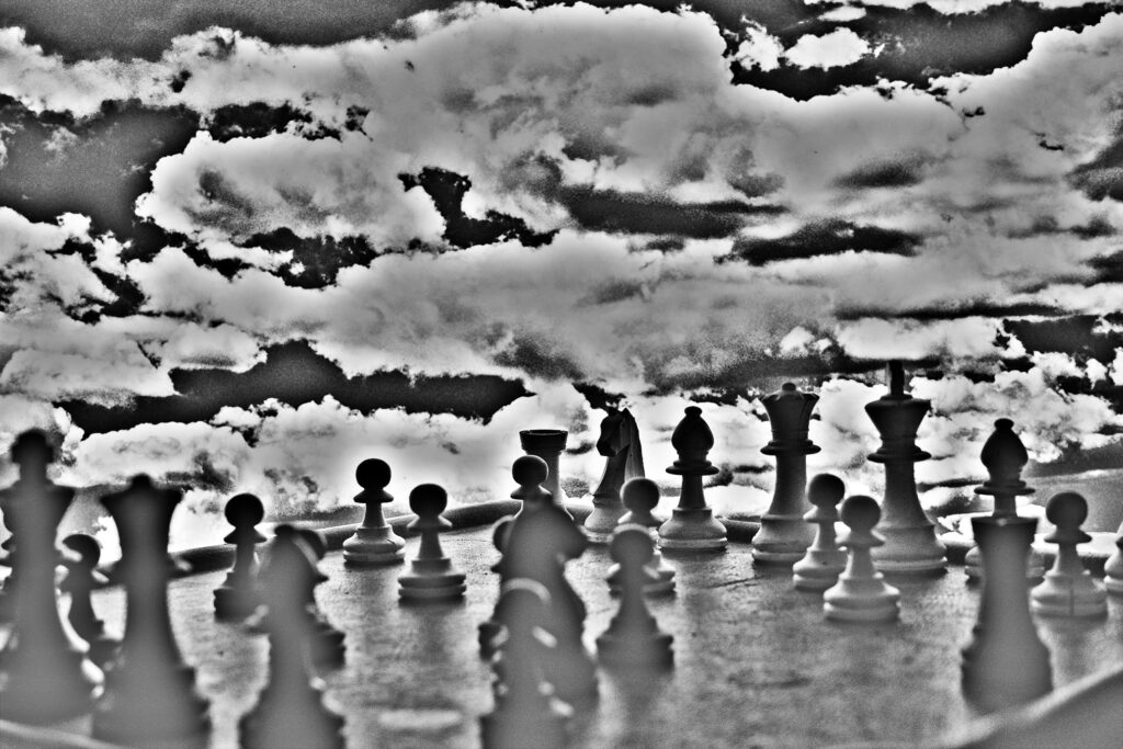 Photo illustration of war using chess pieces and photographic special effects