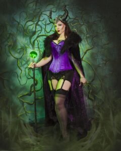 fetish model Kitchie Ohh wearing a purple corset for a fantasy scene
