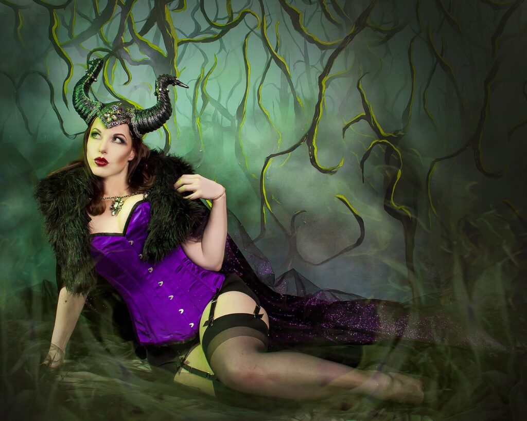 fetish model Kitchie Ohh wearing a purple corset for a fantasy scene
