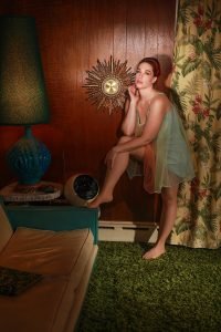 Portrait of contributing writer to Tony Ward Studio Kitchie Ohh wearing lingerie