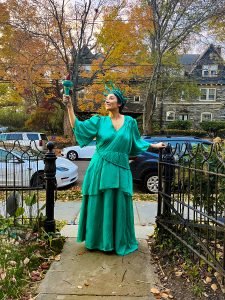 Young beautiful woman dressed as lady liberty on Haloween
