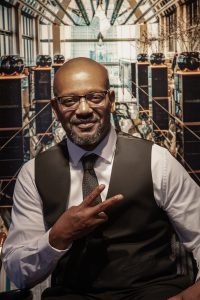 Daniel Gwynn former death row inmate has his portrait taken with a hand signal victory sign by Tony Ward Studio, Copyright 2025